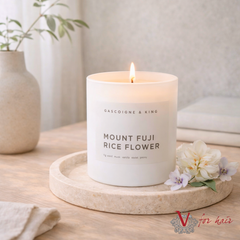Mount Fuji Rice Flower Candle - 400ml lifestyle on side table with flowers
