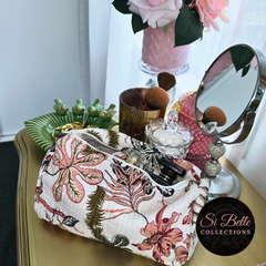 White Coral Sunset Pouch Bag Set full of cosmetics