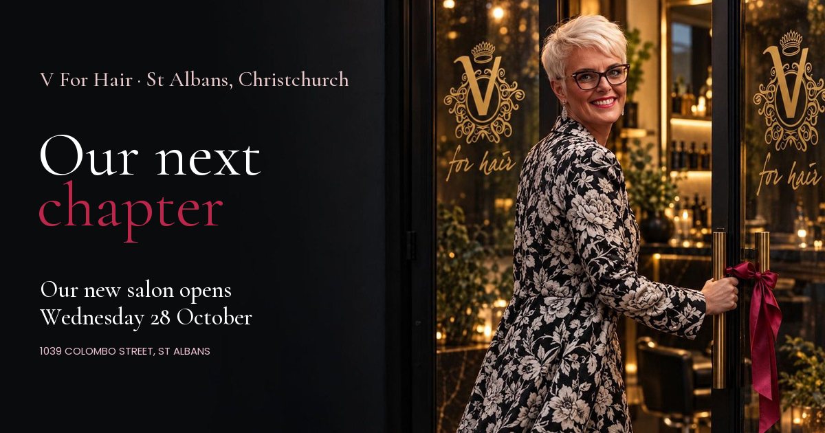 Vicki Ogden-O'Fee opening the glass doors of the new V For Hair salon on Colombo Street