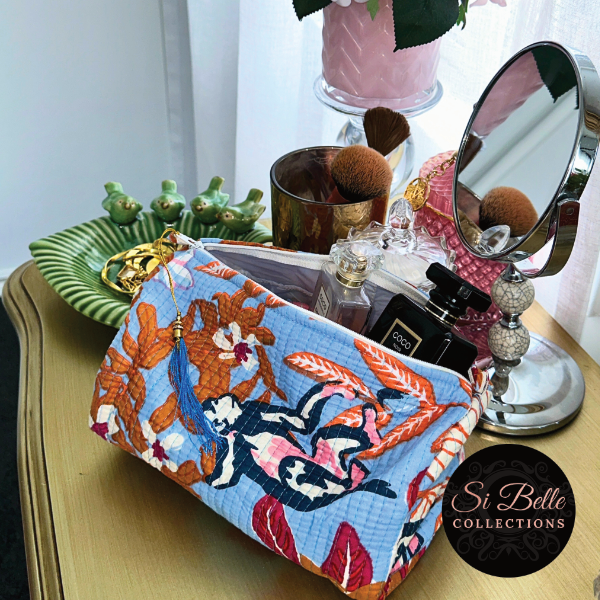 Blue Tropics Pouch Bag Set on dressing table full of cosmetics