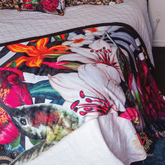 victoria jane lily bird blanket draped over bed