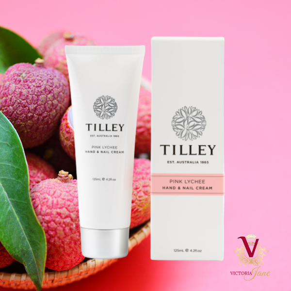 tilley Pink Lychee Hand & Nail Cream  in front of lychees