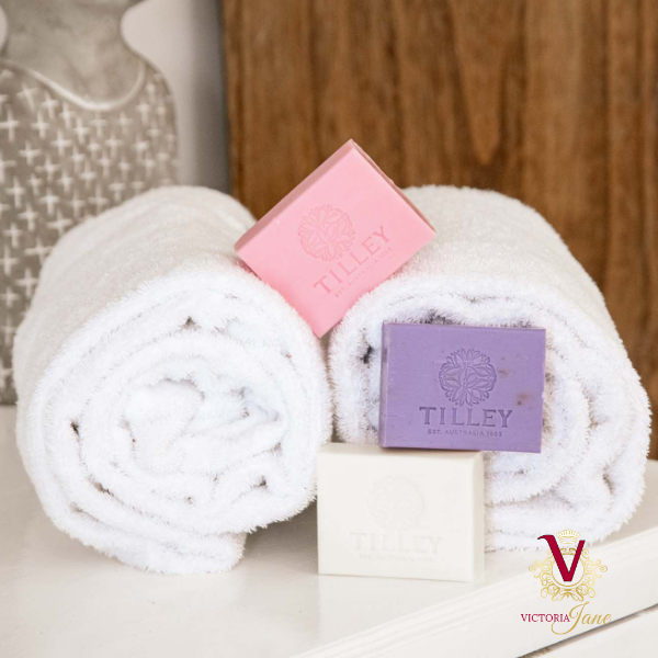 soap trio on towel pink purple and white