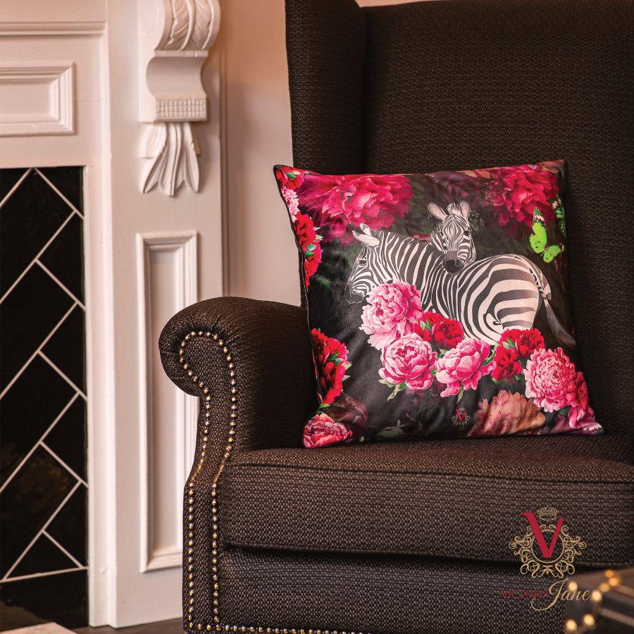 Zebra Rose Velvet Cushion in black chair victoria jane