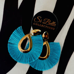 Blue fashion fabric and gold earrings.