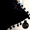 Si Belle Collections - Black Beauty Velvet Pom-Pom Cushion close up edge