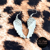 Si Belle Collections - White Angel Wings Earrings on leopard print